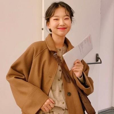 kimehwa worn a coat over a cardigan